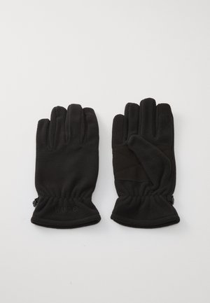 Gants en polaire noire avec une finition texturée, dotés de poignets élastiques et d'un logo subtil embossé au niveau du poignet. Design de doigts notable pour une dextérité optimale.