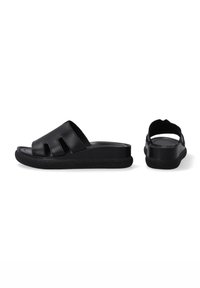 Black slide sandals with a textured sole, open toe, and three cut-out details at the front. Smooth upper material, minimalistic design.