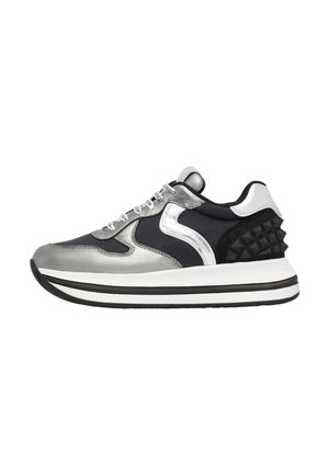 Sneakers featuring a metallic silver upper with navy accents, a textured black back, and white midsole with black stripes.