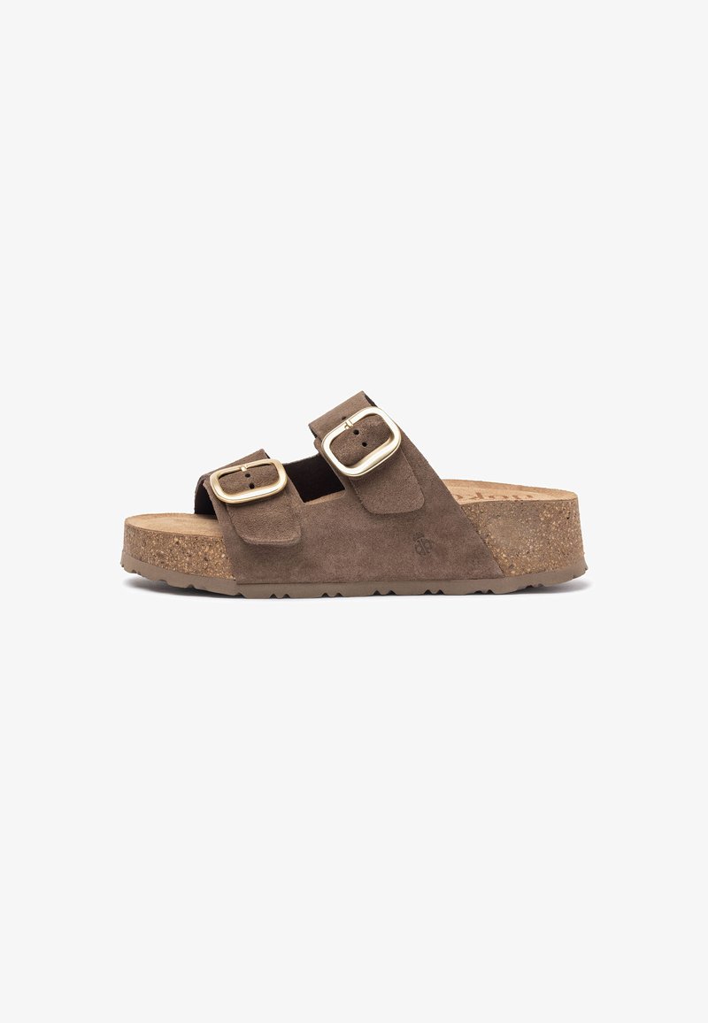 Brown suede slide sandal with two adjustable straps, gold buckles, and a cork footbed. Sandal features a textured rubber sole for grip.
