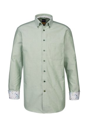 Chemise boutonnière vert clair avec une poche, des poignets à motif floral contrasté et des détails de boutons sur le devant et les poignets.