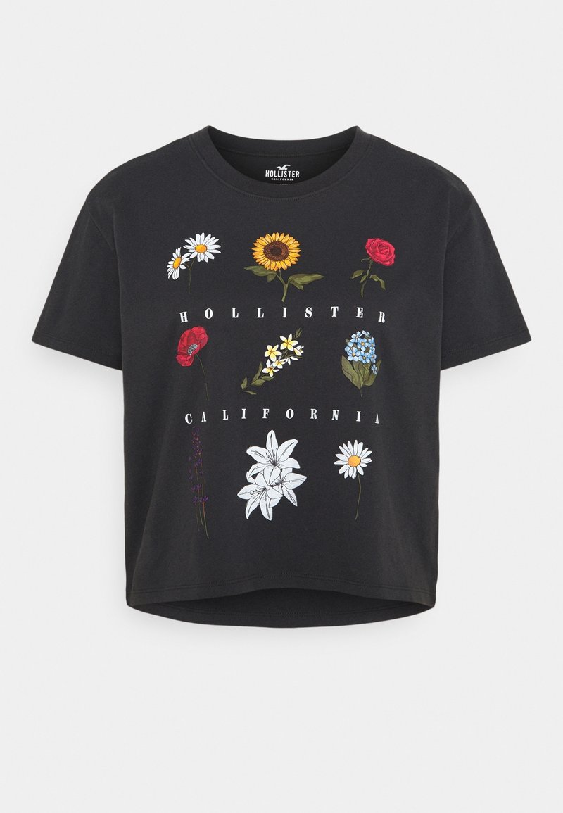 Černé bavlněné tričko s barevnými květinovými motivy. Na designu jsou sedmikrásky, slunečnice, růže a nápis "HOLLISTER CALIFORNIA". Zkrácený střih.