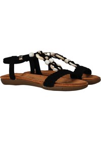 Sandales noires avec des lanières en textile tressé et des perles blanches décoratives. Elles disposent d'une semelle intérieure rembourrée marron et d'une semelle extérieure en caoutchouc flexible.