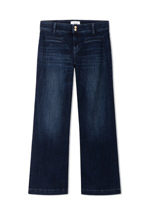 Jean bleu foncé à jambes larges avec double boutonnage doré, passants de ceinture et poches fendues frontales, présenté sur fond blanc.
