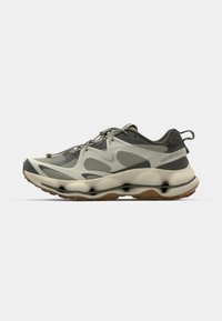 Gray and beige athletic shoes with a mesh upper, rounded soles, and a pull tab. Features elastic laces and a branded heel accent.