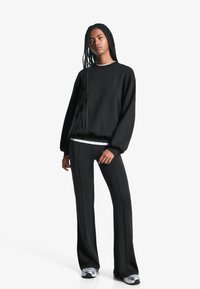 Bershka Sportska majica - black