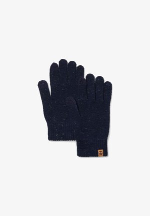 Marineblå strikkede handsker med ribkant, struktureret stof med flerfarvede pletter og et lille brunt logo-tag på håndleddet.