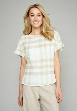 Linnedragt i off-white med subtile beige striber og en afslappet pasform. Korte ærmer med rund halsudskæring, der har et tekstureret mønster.