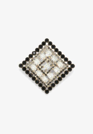 Broșă pătrată cu cristale clare și negre într-un model geometric, montată în metal de culoare aurie cu un design complicat.