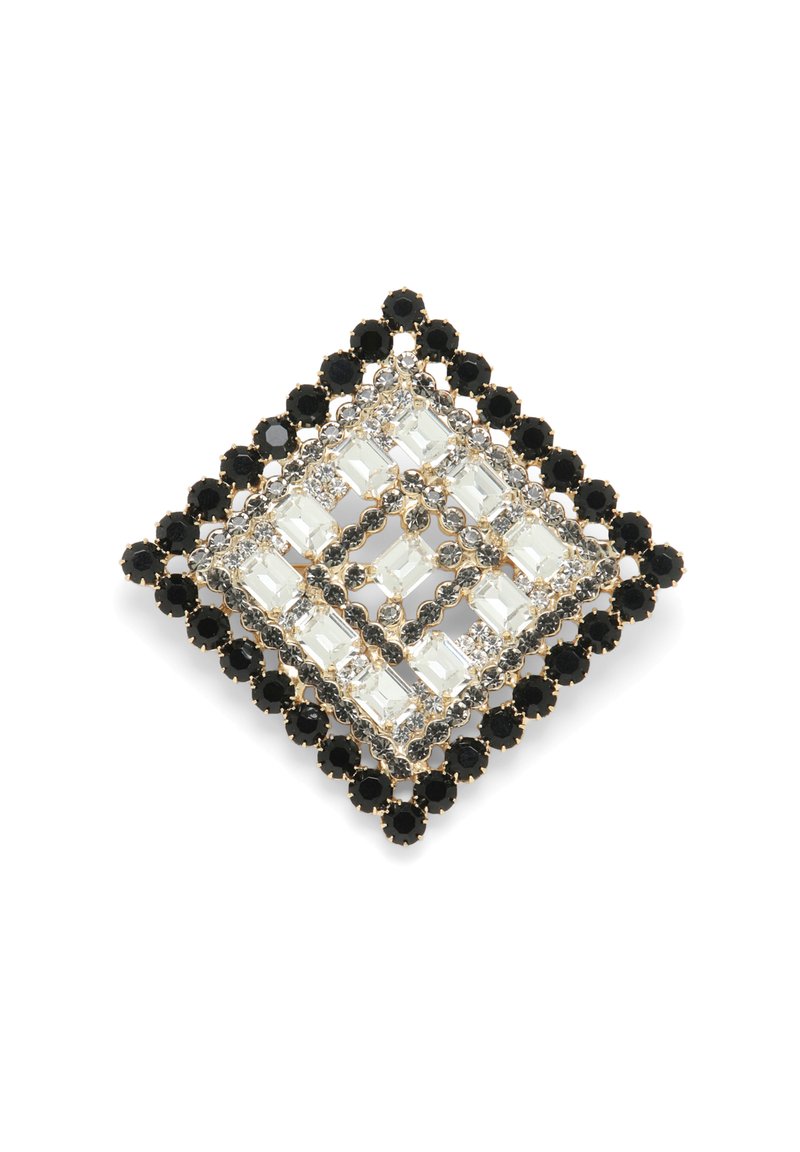 Broșă pătrată cu cristale clare și negre într-un model geometric, montată în metal de culoare aurie cu un design complicat.