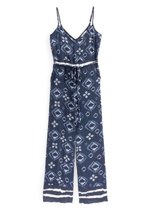 Combinaison sans manches bleu marine avec motif géométrique blanc, ceinture ajustable à la taille et fines bretelles.
