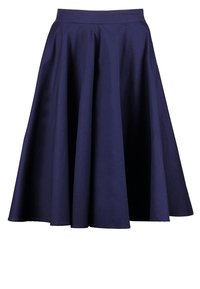 Jupe bleu marine, longueur genou, coupe trapèze avec une ceinture ajustée et de doux plis formant une silhouette évasée.