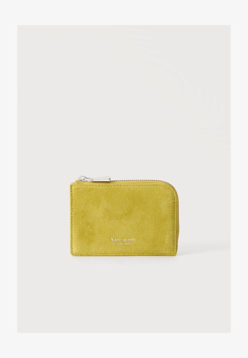 Малко жълто велурено портмоне с цип и лого "kate spade new york" в сребърен текст отпред.
