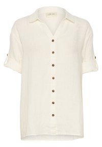 Hvid linned skjorte med korte ærmer og knaplukning, udstyret med brune knapper og optrukne manchetter. Etiketten siger "CREAM."