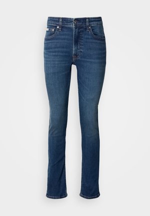 Dark blue denim jeans with a straight leg design, featuring a button closure, five pockets, and subtle fading on the thighs.