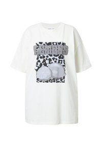 Camiseta de gran tamaño blanca con un gráfico de estampado de leopardo en negro y gris, con dos ilustraciones de limones y la palabra "LEMONS" en letras negritas.