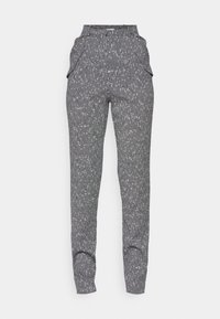 Pantalons gris à motifs avec une surface texturée, taille élastique et poches latérales ; design ajusté avec des poignets aux chevilles.