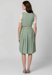 Mint green dress with pleated skirt, lace short sleeves, and a cinched waist. Features subtle polka dots and a smooth texture.