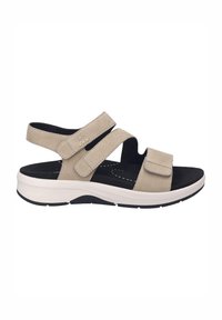 Sandalo in suede beige con cinturini in Velcro regolabili, soletta nera e suola piatta bianca con dettagli neri. Design aperto sul retro e sulla punta.