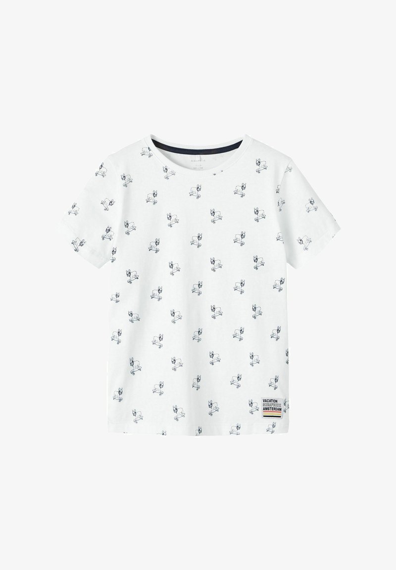 White cotton t-shirt with short sleeves, featuring a pattern of small blue dog illustrations and a label on the lower side.