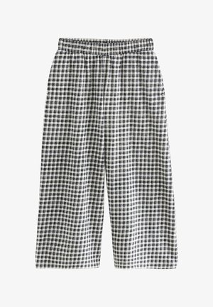 Zwart-wit geruite broek met een elastische tailleband en brede, cropped pijpen, gemaakt van lichtgewicht stof.