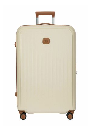 Cremefarbener Hartschalenkoffer mit braunem Besatz, Teleskopgriff und vier Spinner-Rädern.