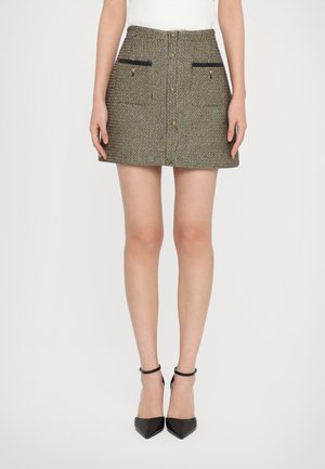 Brown and black woven mini skirt with two front pockets, gold buttons, and black trim accents, featuring a straight silhouette.