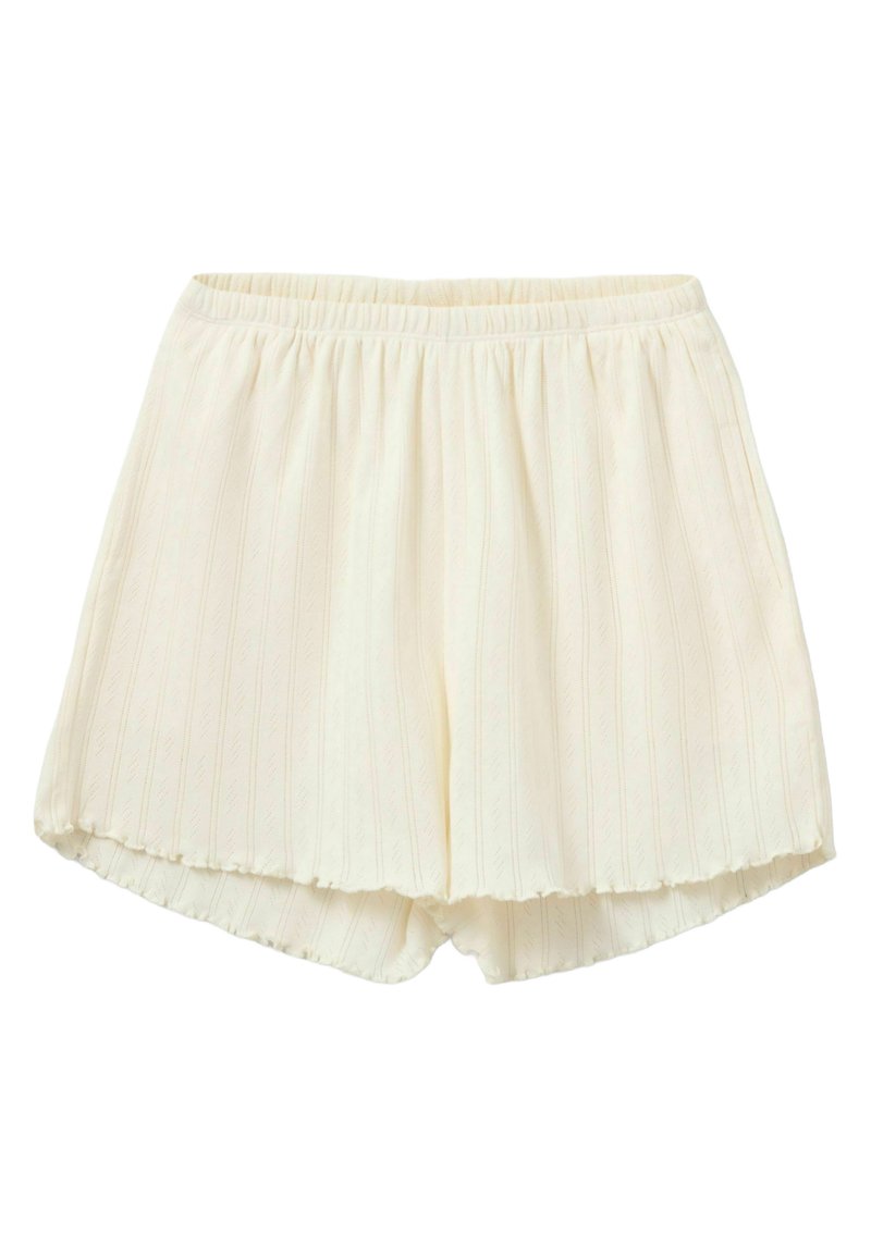 Világos krémszínű rövidnadrág, texturált függőleges csíkos mintával, rugalmas derékkal és fodros szegéllyel. Puha, könnyű anyag.