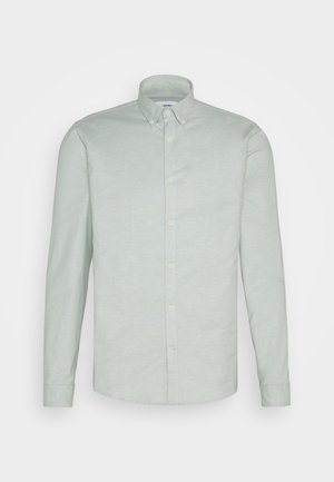 Hellgrünes Langarmshirt aus einem Baumwollmix, mit einem Button-Down-Kragen, einer Knopfleiste vorne und abgerundetem Saum.