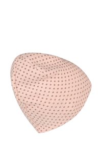 Light pink fabric cap with small dark polka dots evenly spaced, soft texture, and visible stitched seams.