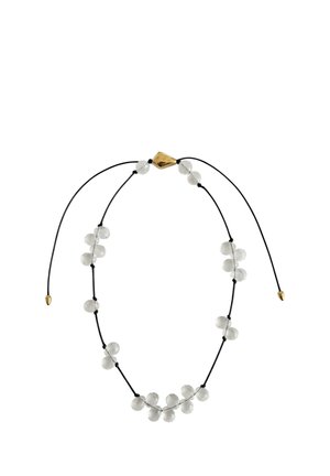 Verstellbare schwarze Kordelkette mit klaren runden Perlen, gleichmäßig verteilt, und einem kleinen goldenen diamantförmigen Verschluss.