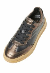 Metallic bronze and navy sneaker with a textured surface, black laces, and a gum rubber sole. Features logo on the tongue and sleek design.