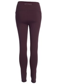 Burgundy leggings med hög midja, tillverkade av ett stretchigt material. Har sömdetaljer och varumärket "SPYDER" på baksidan.