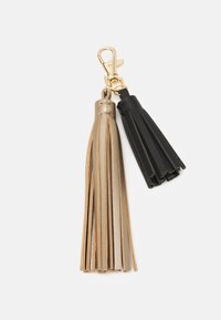 Portachiavi con due frange: una in oro e una in pelle nera, ciascuna con diverse strisce di frange, attaccate a un clip in metallo dorato.