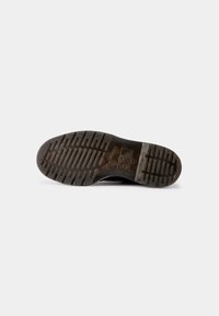Dr. Martens Šněrovací kotníkové boty - black