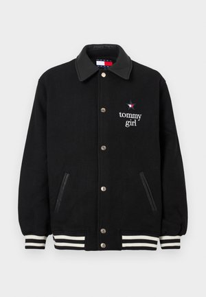 Black varsity jacket with a shiny collar, logo, and embroidered text. Features white and black striped cuffs and side pockets. Buttons down the front.