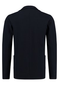 Schwarzer Blazer mit langen Ärmeln, einem Reverskragen, strukturierter Form, zwei seitlichen Taschen und strukturiertem Stoff. Schlichte Rückseite ohne Verzierungen.