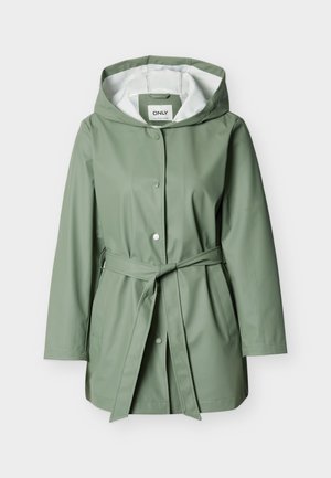 Heleroheline kapuutsiga vihmamantel esiotsa nööpidega, vöökohal vöö, küljetaskud ja valge sisevooder.