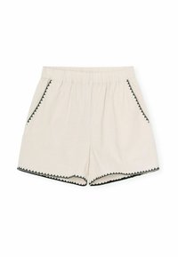 Beige Baumwollshorts mit elastischem Bund, versehen mit schwarzem Ric-Rac-Besatz entlang der Taschen und dem Saum. Einfaches Design, lässige Passform.