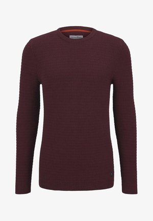 Bordowy sweter dziany z teksturowanym wzorem, okrągłym dekoltem, długimi rękawami i ściągaczami. Zawiera pomarańczowy akcent wewnątrz kołnierza.