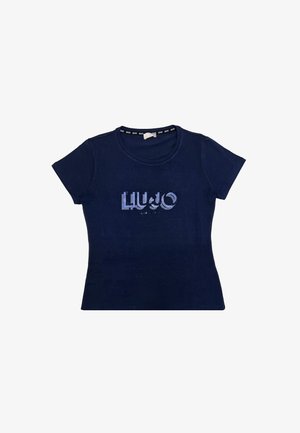 T-shirt in cotone blu navy con maniche corte e scollo rotondo, caratterizzato da un design di logo glitterato sulla parte anteriore. Texture morbida, stile aderente.