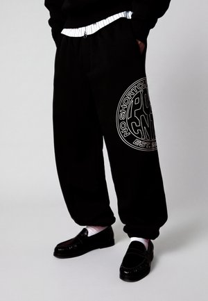 Bershka, PRINT JOGGERS -  TROUSERS - Pantalon de survêtement - black