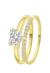 Goldring-Set mit einem herzförmigen klaren Stein und einem Band mit kleinen runden klaren Steinen. Glatte Oberfläche mit reflektierenden Flächen.