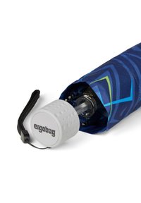 Blue patterned umbrella featuring a white ergonomic handle with a textured grip and the logo "ergobag." Compact design for easy storage.
