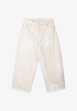 Beige wide-leg pants in cotton blend, featuring large white flower patterns, front button closure, and traditional five-pocket style.