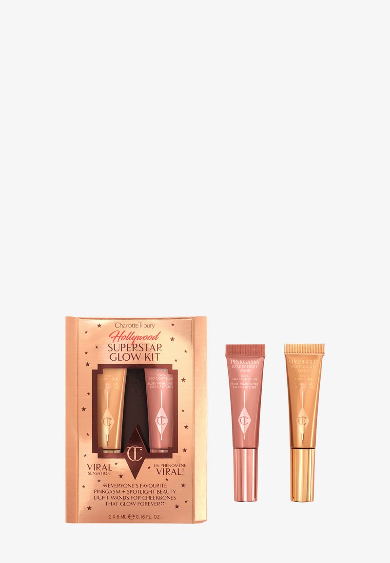 Charlotte Tilbury Hollywood Superstar Glow Kit in a rose gold box with star accents. Two tubes: one pink and one gold, each 5ml.