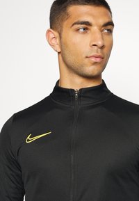 Nike Performance M NK DRY ACD21 TRK SUIT K - Fato de treino - black/laser orange