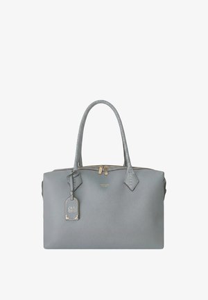 Sac à main en cuir gris avec deux poignées cousues, fermeture éclair dorée et une étiquette de marque suspendue sur le devant.