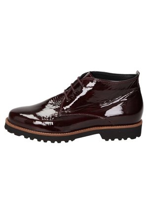 Dunkler bordeauxfarbener glänzender Leder-Schnürstiefel mit schwarzer Gummisohle und braunen Kanten-Details.