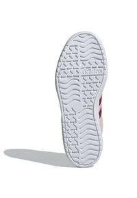 Suola di scarpa in gomma bianca con un motivo di trama testurizzata e logo visibile. Il design include un bordo leggermente rialzato.